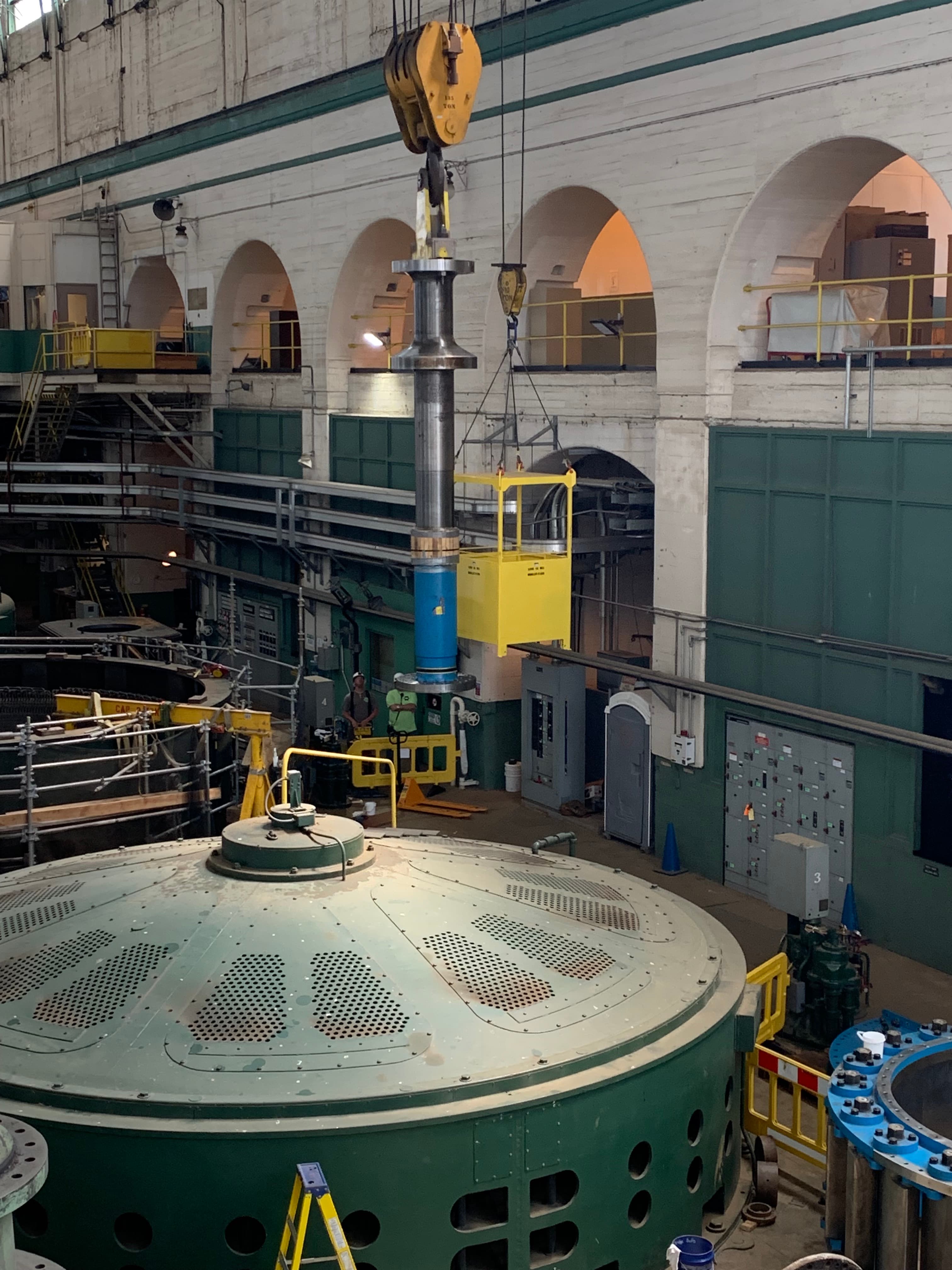 Four 180 MW Francis runners staged on the shop floor during a coordinated overhaul.